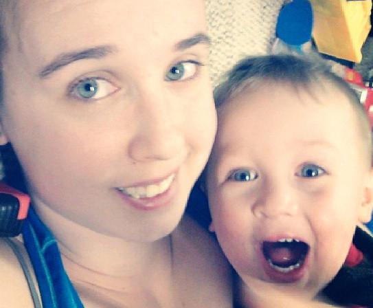 Sister and baby smiling
