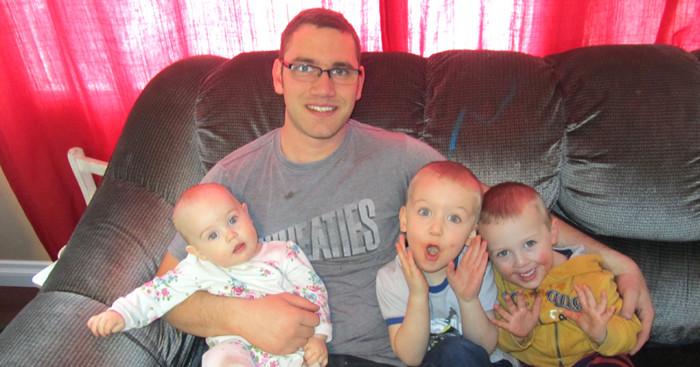 Father with 3 children on couch
