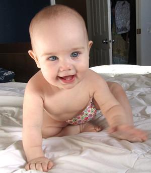 crawling baby in Charlie Banana Reusable Cloth Diaper
