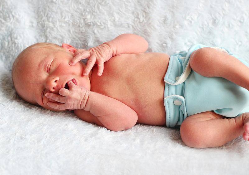 Baby in blue Charlie Banana Reusable Cloth Diaper